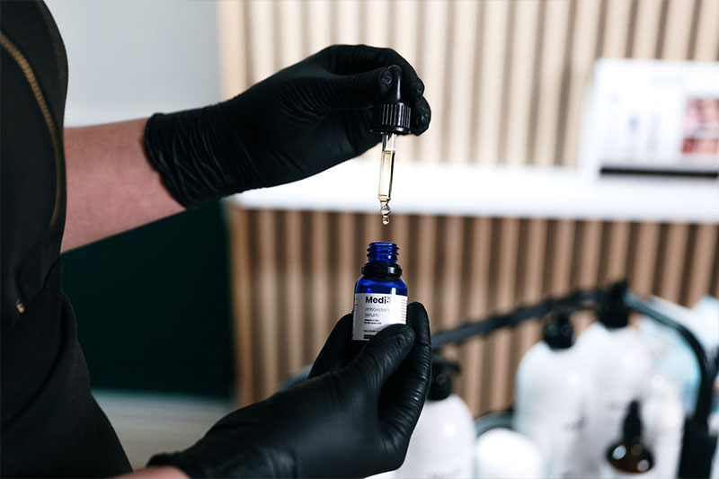 Therapist using antioxidant serum in North Wales