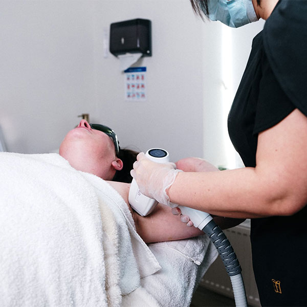 Woman receiving under arm laser hair removal at Mold clinic